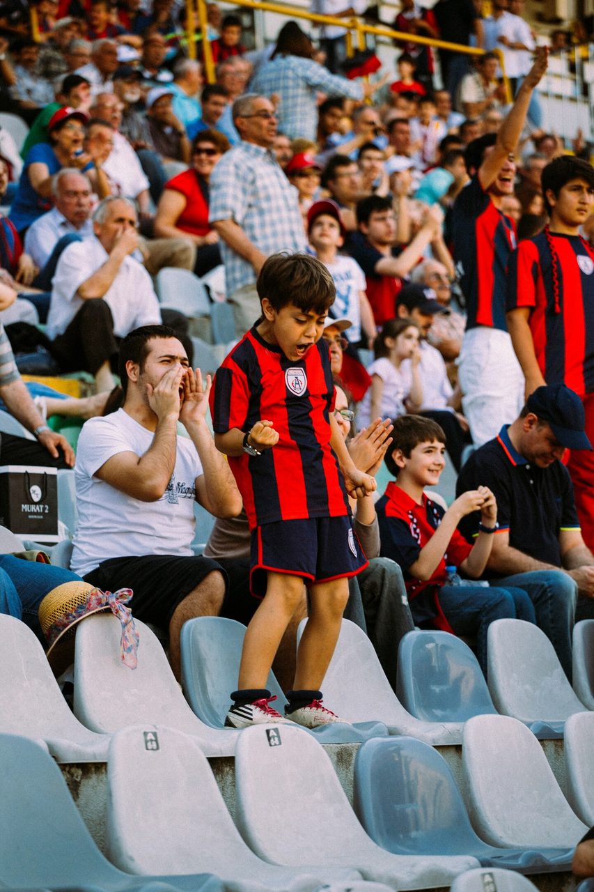 Fans cheering in stadium seats