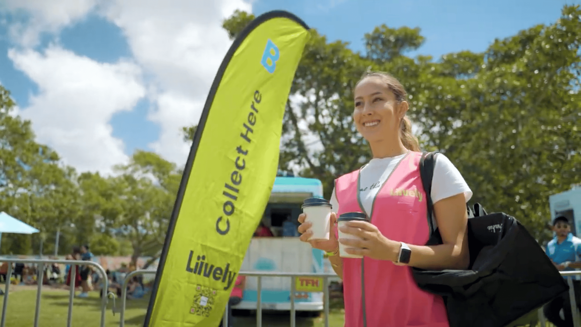 A Liively Collect Here flag at an outdoor event